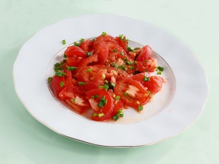 tomatoes,onion's  green leaves as tasty salad