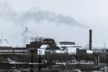 industrial waste and air pollution with black smoke from a pipe, a concept of air pollution and the...