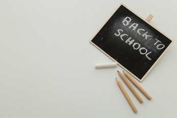 back to school concept with pencils and black board.