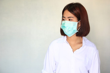 Viruses, Portrait of young woman wearing face mask for protect smog or PM 2.5 and viruses on white background, illness, Health concept