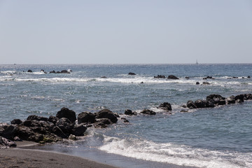 beach with waves crashing on beach