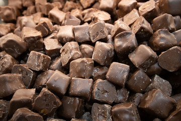 Chocolate covered with cotton candy close-up. Photographed on the counter in front of the store.