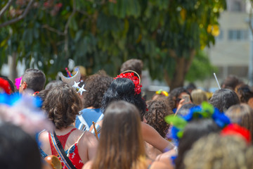 Revelers Parade behind the samba school at the street