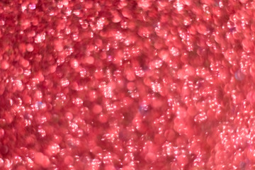 Red and pink shiny background. Bokeh. Shine. The side with sequins. Magic