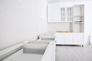 Fototapeta na wymiar Stylish kitchen interior with newly installed furniture