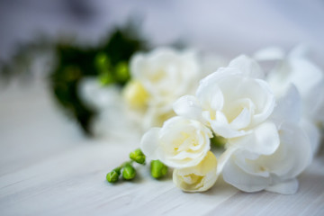 Naklejka na ściany i meble freesia flowers on a wooden table