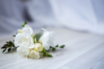 Obraz na płótnie Canvas freesia flowers on a wooden table