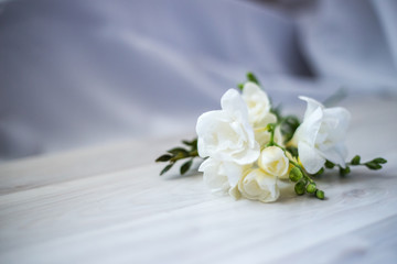 Obraz na płótnie Canvas freesia flowers on a wooden table
