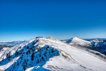 Fototapeta na wymiar snowy mountains at clear day in slovakia in low tatras, slovakia tatras