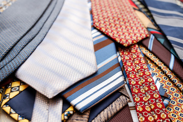 Men's fashion: many colorful ties.