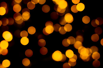 Blurred abstract gold glitter texture, defocused christmas lights. Holiday christmas concept. 