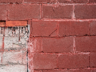 Grey and red concrete brick wall surface