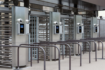 Modern turnstile at the stadium. Card access system, video surveillance, scanner, barrier.