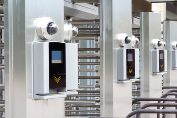 Modern turnstile at the stadium. Card access system, video surveillance, scanner, barrier. Close up.