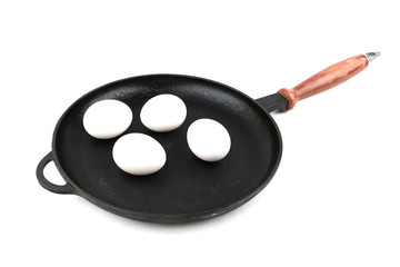 four raw eggs is on the pan on white background