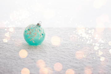 Fototapeta na wymiar Christmas ball on the snow.