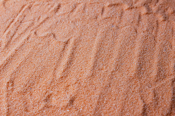 Abstract background of orange artificial sand
