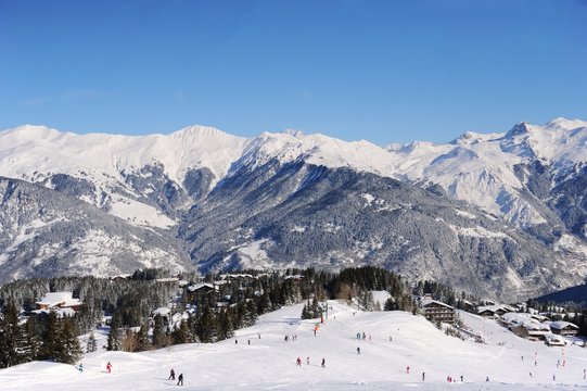 Ski resort Courchevel in winter with snowy mountains and ski slopes © raeva