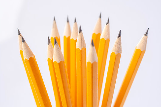 Yellow pencils on white background.
