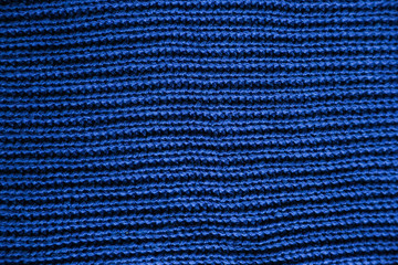  Classic blue dark knitted background. Close up texture . wrinkled and shadows, top view. 2020 trend color