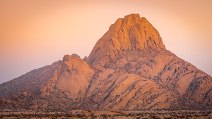 The Spitzkoppe mountain at sunrise in Namibia in Africa.