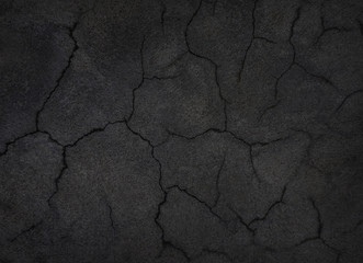 Black old concrete wall with crack.