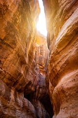 Canyon narrow path way between steep rocks, Petra, Jordan