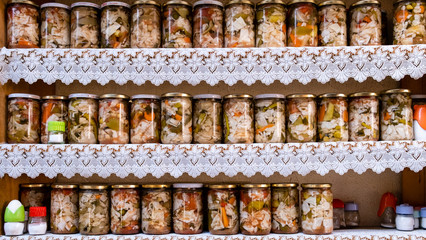 Winterly pickled jars on the kitchen shelves.