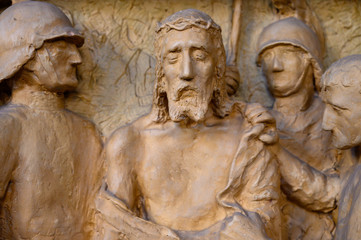 Obraz premium Pápa, Hungary. 2020/2/13. Jesus is stripped of His clothes. Station of the Cross. Church of Saint Stephen in Pápa, Hungary.