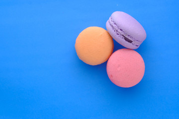 top view of colorful macaroon on color background 