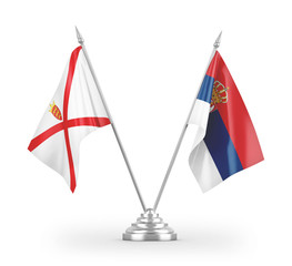 Serbia and Jersey table flags isolated on white 3D rendering