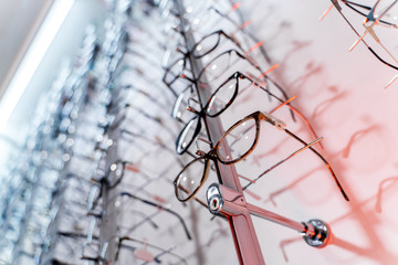 Fototapeta na wymiar Eyeglasses in a store. Eyesight correction. Optics. Ophthalmology.