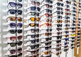 Sales rack of sunglasses. A colorful display of sunglasses for sale