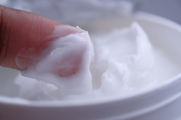 Fototapeta na wymiar Close up of face cream in a container 