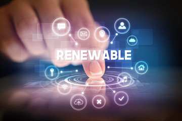 Finger touching tablet with web technology icons and RENEWABLE inscription, web technology concept