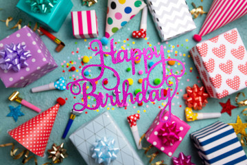 Obraz premium Happy birthday greeting card. Party background with colorful party accessories. Happy birthday background. Top view, flat lay