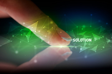 Finger touching tablet with SOLUTION inscription, business concept