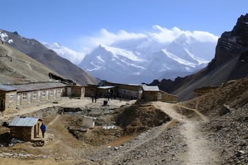 High Camp around Thorong La Pass in Himalaya, Nepal - the highest lodge on trail before pass. Snowy Annapurna III and Gangapurna in background. During trekking around Annapurna, Annapurna Circuit.