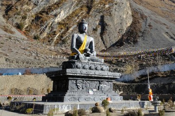 Sakyamuni Buddha Statue in Muktinath in Nepal, Mustang Land, Himalaya. During trekking around...