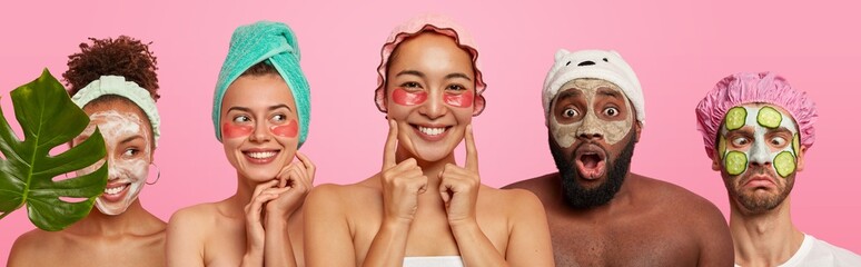 Photo of mixed race young women and man express different emotions, wear cosmetic masks and under eye patches, want to have healthy skin and well cared comlexion, pose bare shoulders indoor.