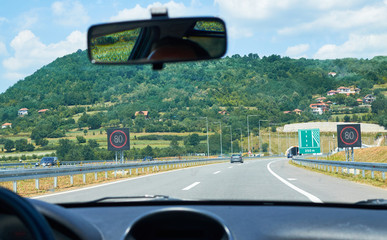 Fototapeta na wymiar Highway in Serbia through a picturesque landscape in springtime