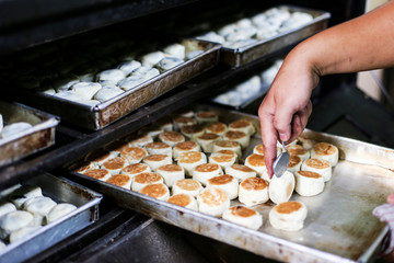 Baking Bakpia in the Oven, Bakpia Pathok Jogja is traditional cake from Special region of Jogjakarta Indonesia, Made from rice powder and mung bean