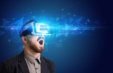 Businessman looking through Virtual Reality glasses with PROXY SERVER inscription, cyber security concept