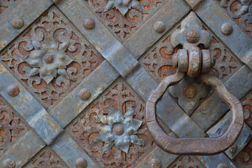 Iron handle on an old forged door