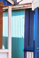 Abstract view of Beach huts. Sutton on Sea beach hut juxtaposition of colours and structure of huts. Various colours in vivid shades and brightness. Summertime holiday resort. 