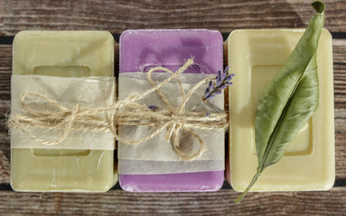 soap of light shades from natural ingredients on a wooden surface