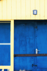 Abstract view of Beach huts. Sutton on Sea beach hut juxtaposition of colours and structure of huts. Various colours in vivid shades and brightness. Summertime holiday resort. 