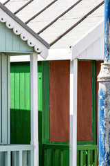 Abstract view of Beach huts. Sutton on Sea beach hut juxtaposition of colours and structure of huts. Various colours in vivid shades and brightness. Summertime holiday resort. 