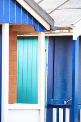 Abstract view of Beach huts. Sutton on Sea beach hut juxtaposition of colours and structure of huts. Various colours in vivid shades and brightness. Summertime holiday resort. 