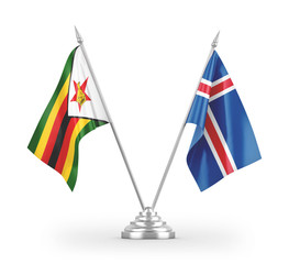 Iceland and Zimbabwe table flags isolated on white 3D rendering
